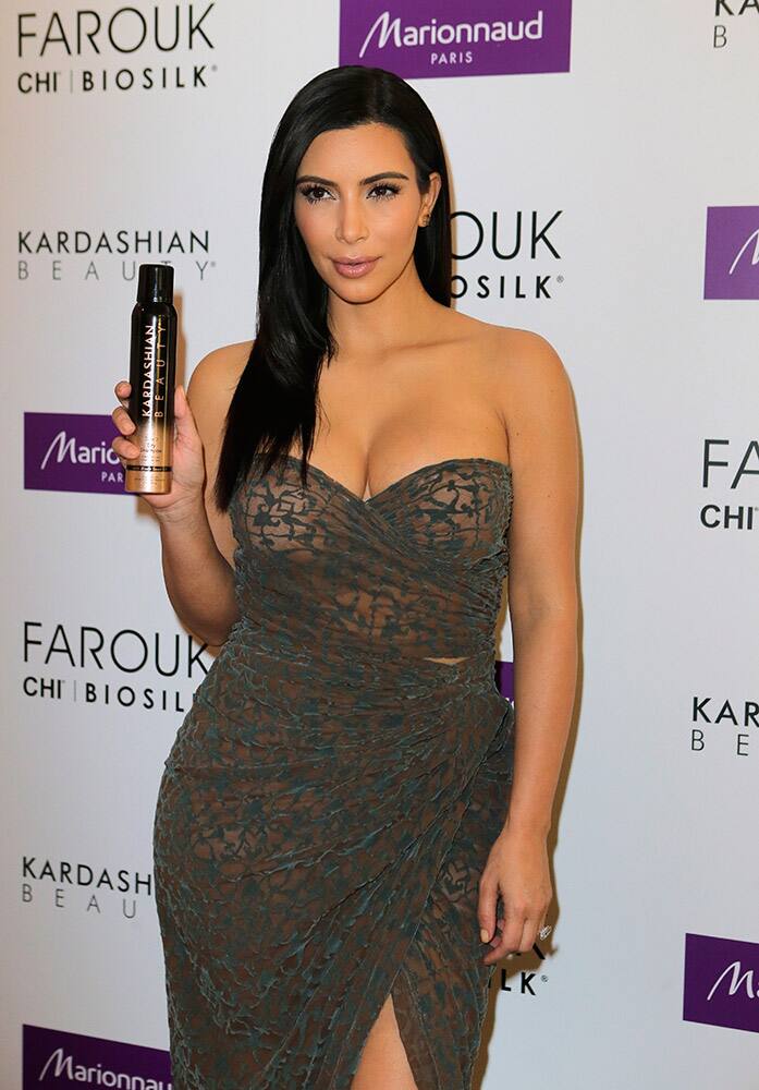 Kim Kardashian attends a photocall to launch hair products in Paris, France.