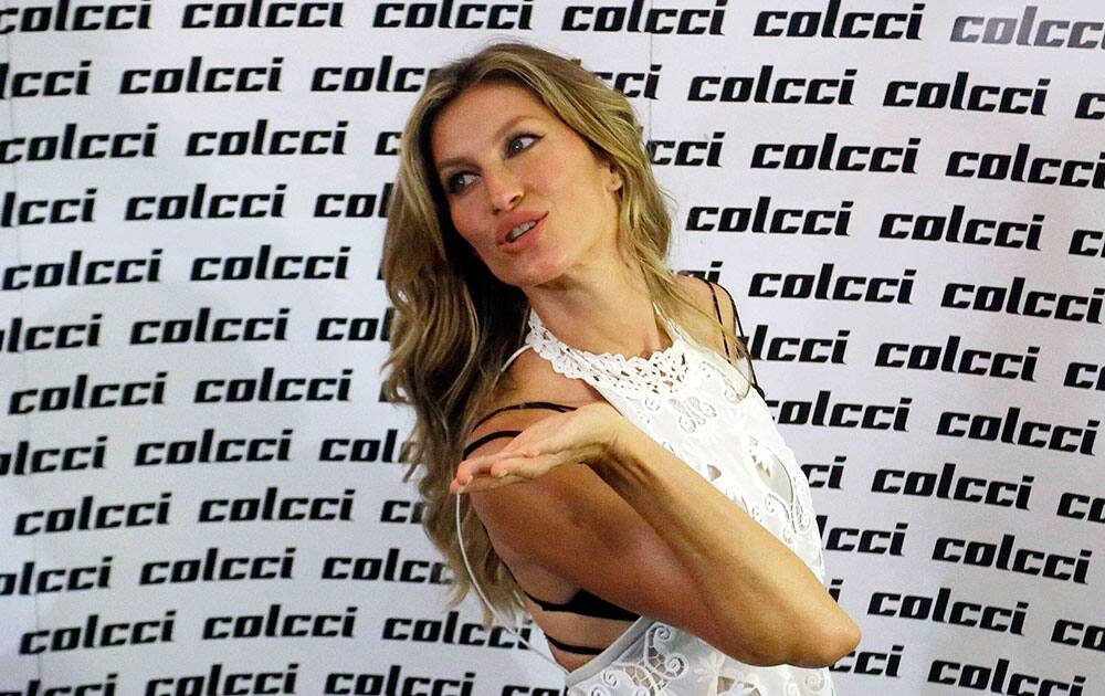 Brazilian model Gisele Bundchen blows a kiss as she pose for photos during the Sao Paulo Fashion Week.