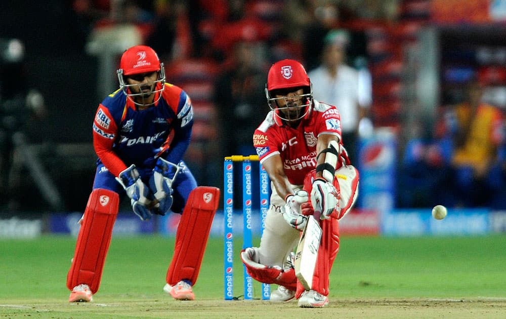 Kings XI Punjab player Wriddhiman Saha plays a shot during an IPL match with Delhi Daredevils in Pune.