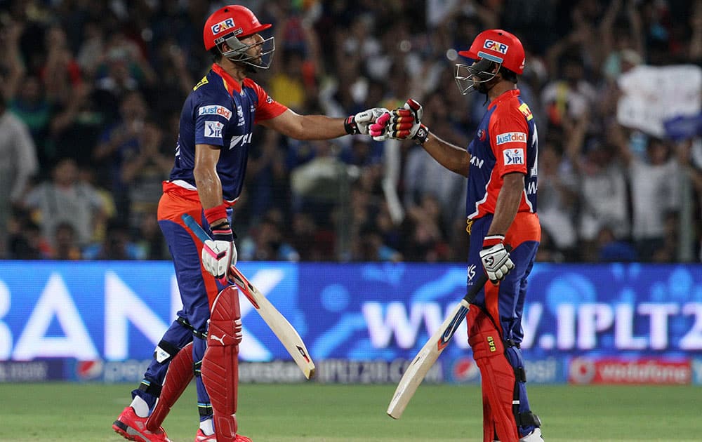 Daredevils player Yuvraj Singh and Delhi Daredevils player Mayank Agarwal during an IPL T20 match against Kings XI Punjab in Pune.