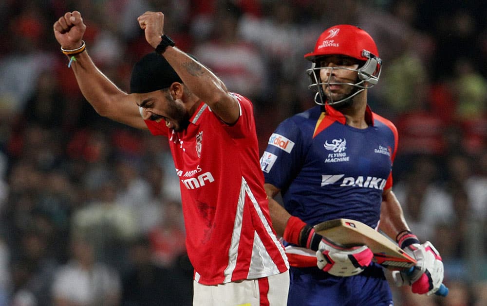 Kings XI Punjab player Anureet Singh celebrates the wicket of Delhi Daredevils player Yuvraj Singh during an IPL T20 match in Pune.