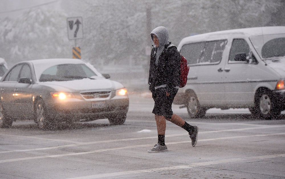 A Highland High School student walks to school Wednesday, April 15, 2015, in Salt Lake City.