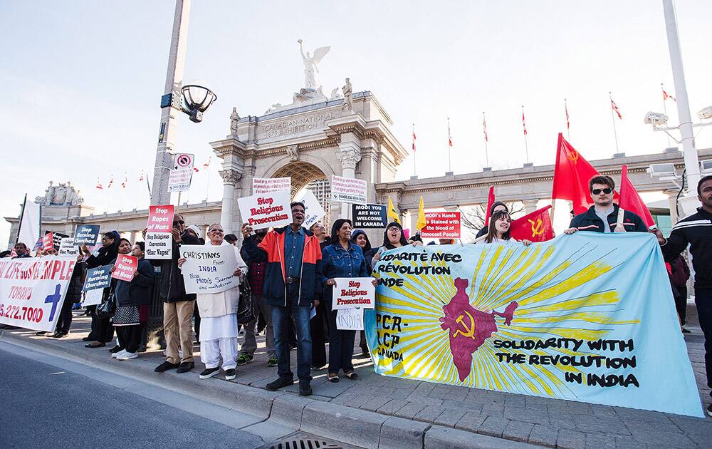 Protesters gather outside of Exhibition Place where Canadian Prime Minister Stephen Harper is welcoming Prime Minister Narendra Modi at the Ricoh Coliseum.