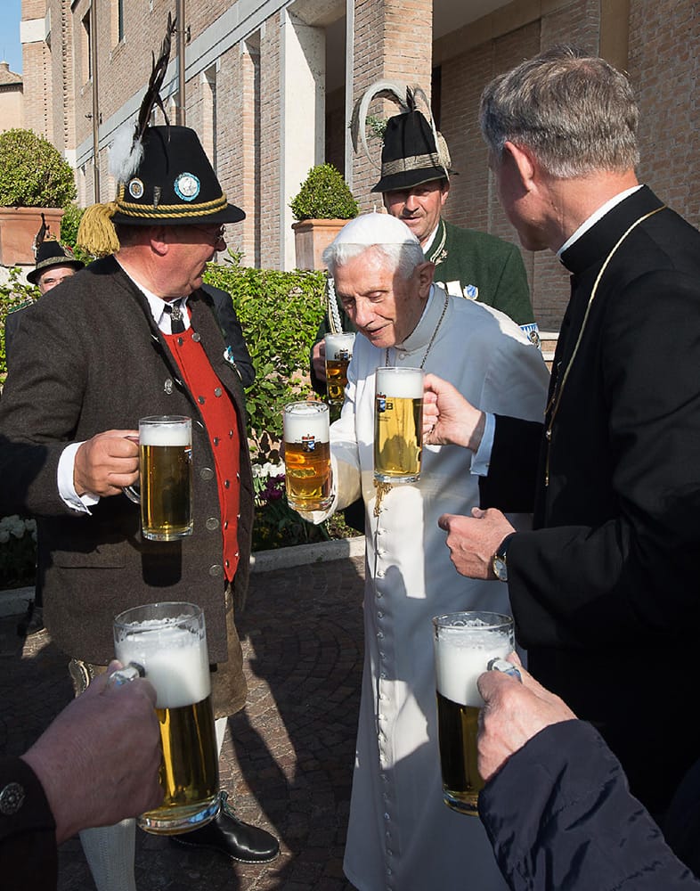 Pope Emeritus Benedict XVI toasts for his 86th birthday with his brother Georg Ratzinger, Monsignor Georg Gaenswein and members of a group from his hometown Bavaria region, in the pontiff's Castel Gandolfo residence, in the hills overlooking Rome.