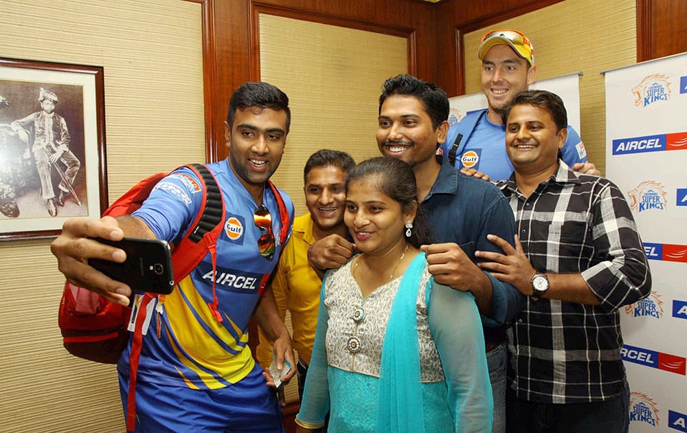 Chennai Super Kings players R Ashwin and Kyle Abbot meet first winner of the Aircel CSK contest in Mumbai.