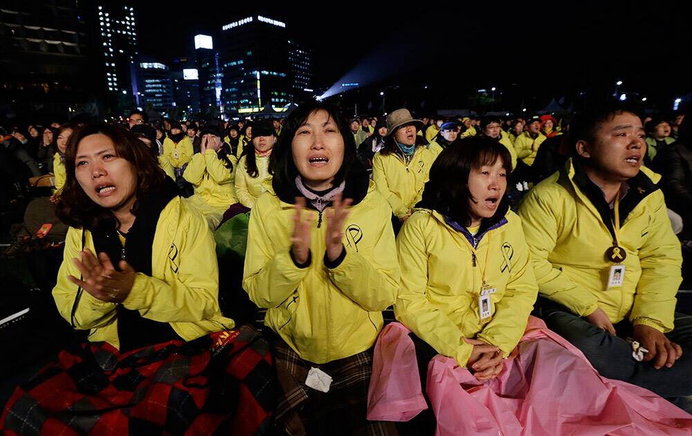 Family members of the ferry victims shout during a rally to commemorate the first anniversary of the Sewol ferry sinking in Seoul, South Korea.