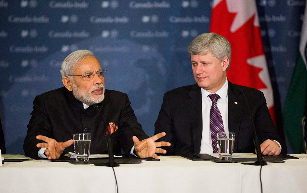 Canadian Prime Minister Stephen Harper, participates in a business roundtable with Prime Minister Narendra Modi, in Toronto.