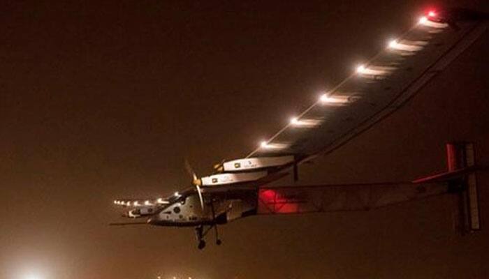 First around the world solar-powered plane grounded by weather in China