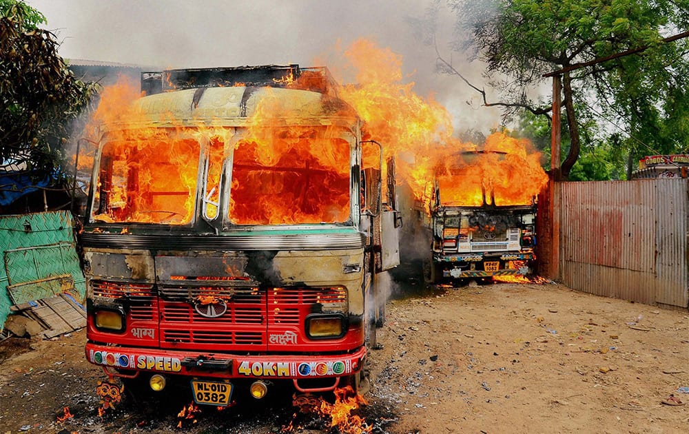 Trucks in flames after irate mob set them ablaze and tried to do the same to a godown in Shalimar area of Howrah district in West Bengal following the death of the brother of a local councillor in hospital. The councilors brother sustained fatal injuries in a group clash.