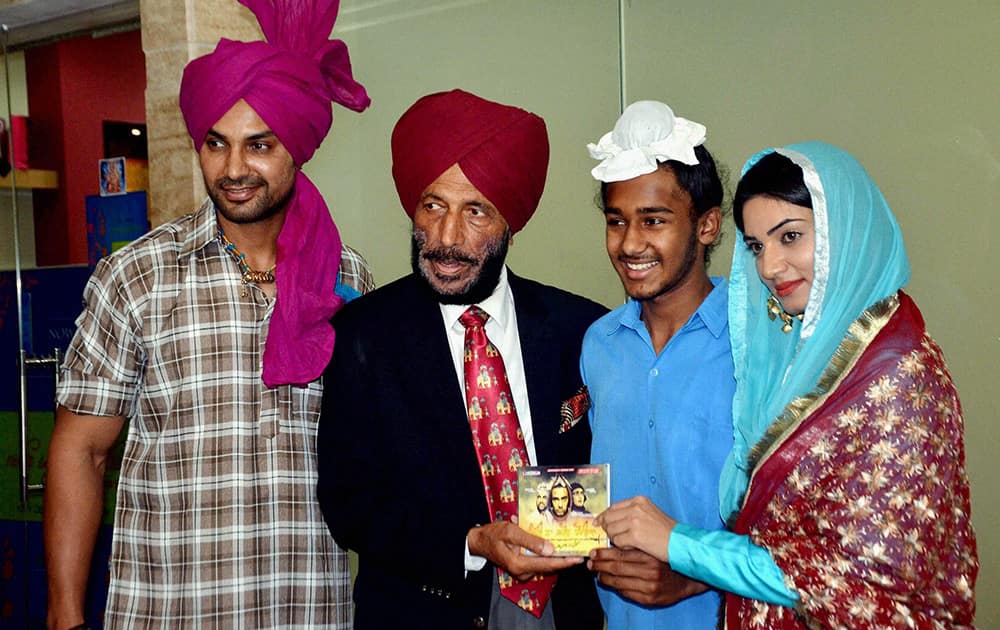 Sports icon Milkha Singh launching the music of a film with Japtej Singh of Bhaag Milkha Bhaag fame and Kartar Cheema (L) in Chandigarh.