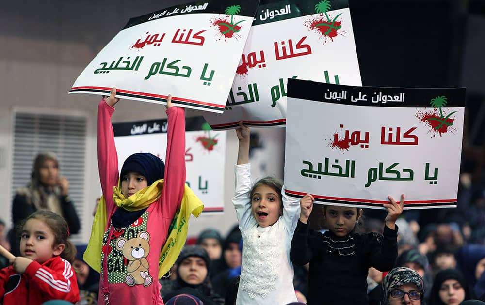 Lebanese children hold up placards in Arabic that read 'we are all Yemen, oh Gulf rulers,' as they listen to Hezbollah leader Sheikh Hassan Nasrallah during a rally titled 'in solidarity with oppressed Yemen' in the southern suburb of Beirut, Lebanon.