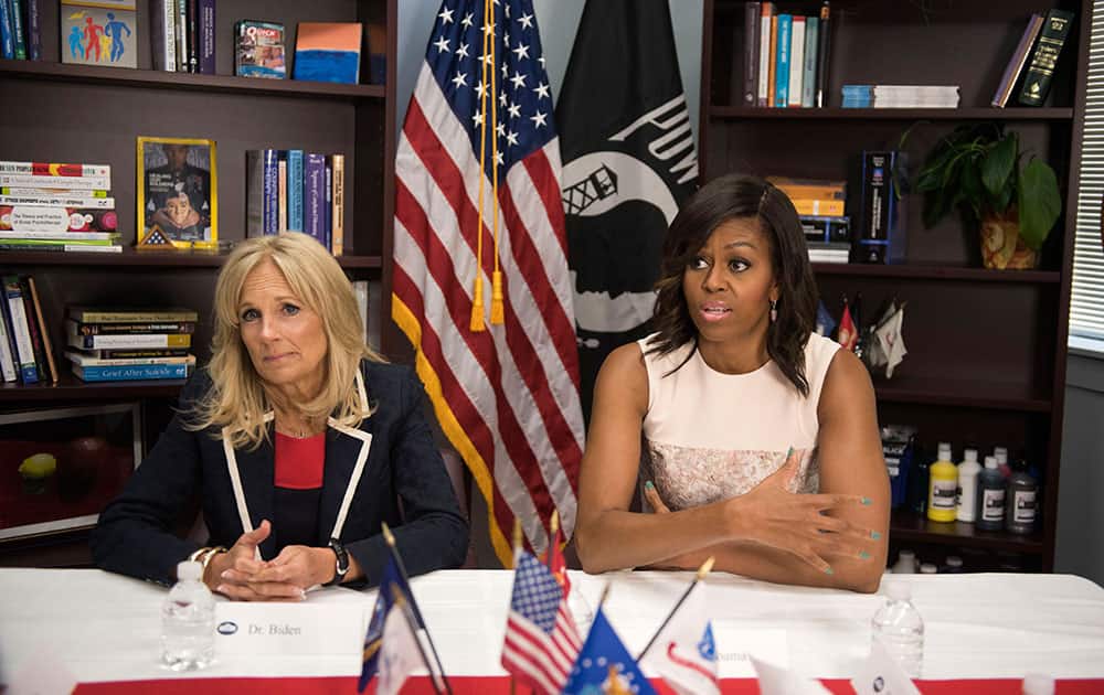 First lady Michelle Obama and Jill Biden meet with Vet Center clients and staff during a visit to the facility in Silver Spring, Md.