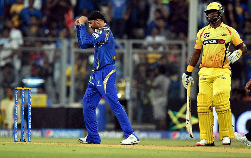 Mumbai Indians bowler Harbhajan Singh celebrates a wicket of Chennai Super Kings batsman D Smith during a IPL T20 match played in Mumbai.