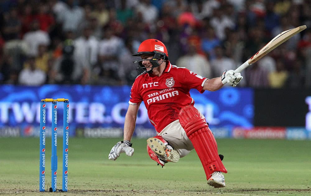 Kings XI Punjab captain George Bailey slips as he tries to plays a shot during an IPL match between KKR and KXI Punjab in Pune.