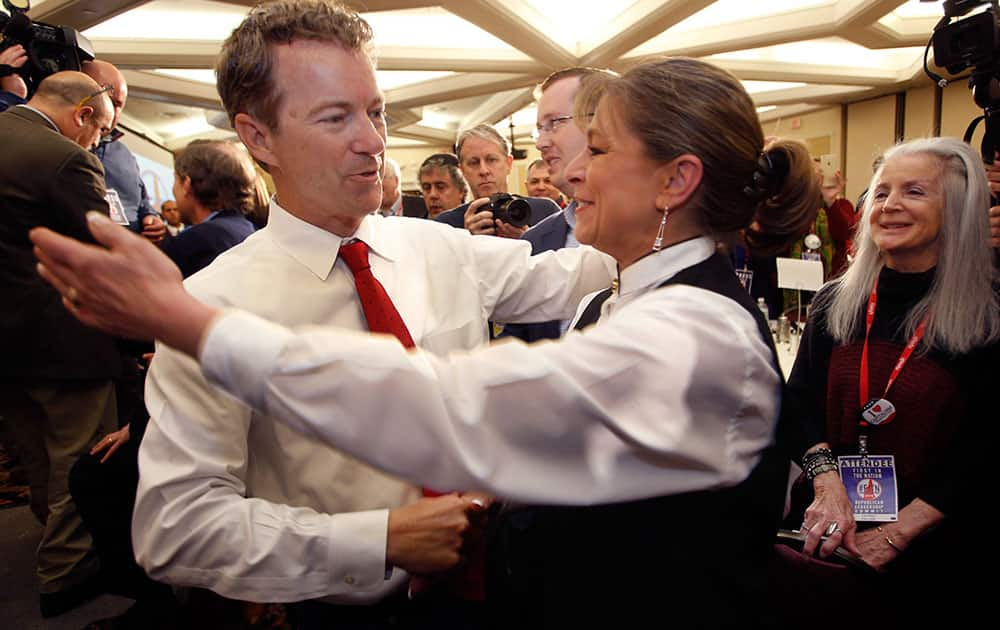 Republican presidential hopeful Sen. Rand Paul, R-Ky., gets a hug after speaking at the Republican Leadership Summit.