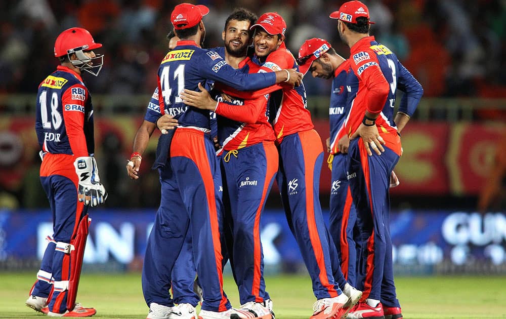 Delhi Daredevils captain Jean-Paul Duminy celebrates with teammates after getting Sunrisers Hyderabad captain David Warners wicket during IPL match.