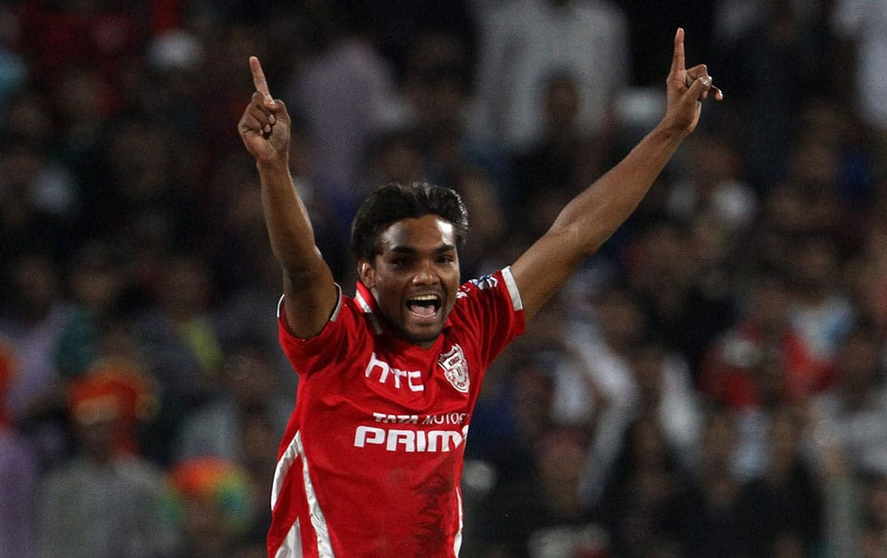 Kings XI Punjab player Sandeep Sharma celebrates the wicket of Kolkata Knight Riders captain Gautam Gambhir during an IPL match between KKR and KXI Punjab.