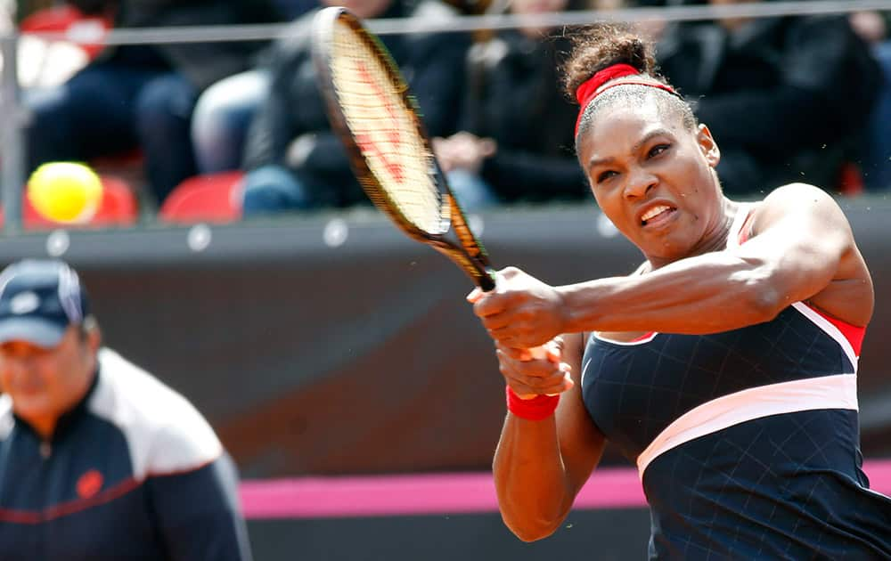 Serena Williams of United States returns the ball to Italy's Sara Errani during a Fed Cup World Group playoff tennis match in Brindisi, Italy.