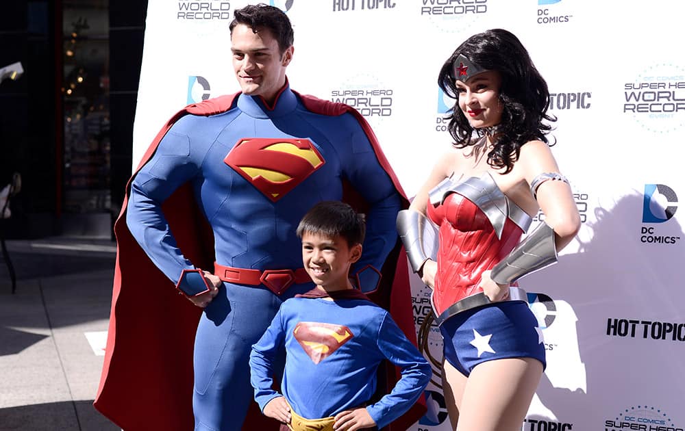 Fans pose dressed as DC Comics Super Heroes at the DC Comics Super Hero World Record Event to set a Guinness World Record at the Hollywood & Highland Center in Los Angeles.