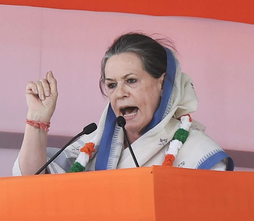 Congress President Sonia Gandhi addressing the large gathering during the farmers rally at Ramlila Maidan in New Delhi.