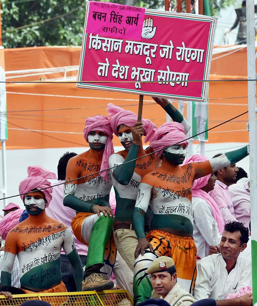 Supporters painted in tricolours at the farmers rally oraganised by Congress party at Ramlila Maidan in New Delhi.