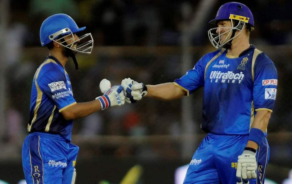 Rajasthan Royals player Ajinkya Rahane with team captain Shane Watson after scoring a fifty during a T-20 match with Chennai Super Kings in Ahmedabad.