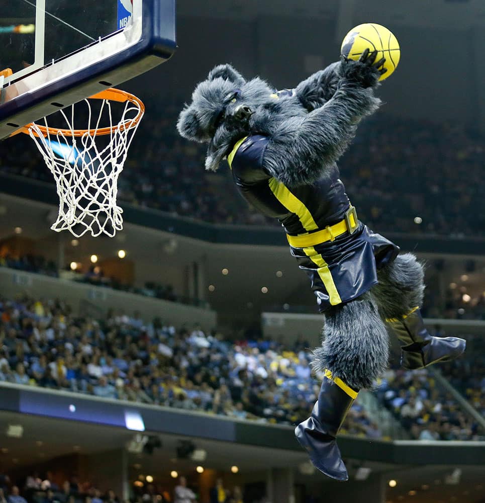 The Memphis Grizzlies' mascot dunks a ball during a timeout in the second half of Game 1 of an NBA basketball Western Conference playoff series between the Grizzlies and the Portland Trail Blazers, in Memphis, Tenn. 