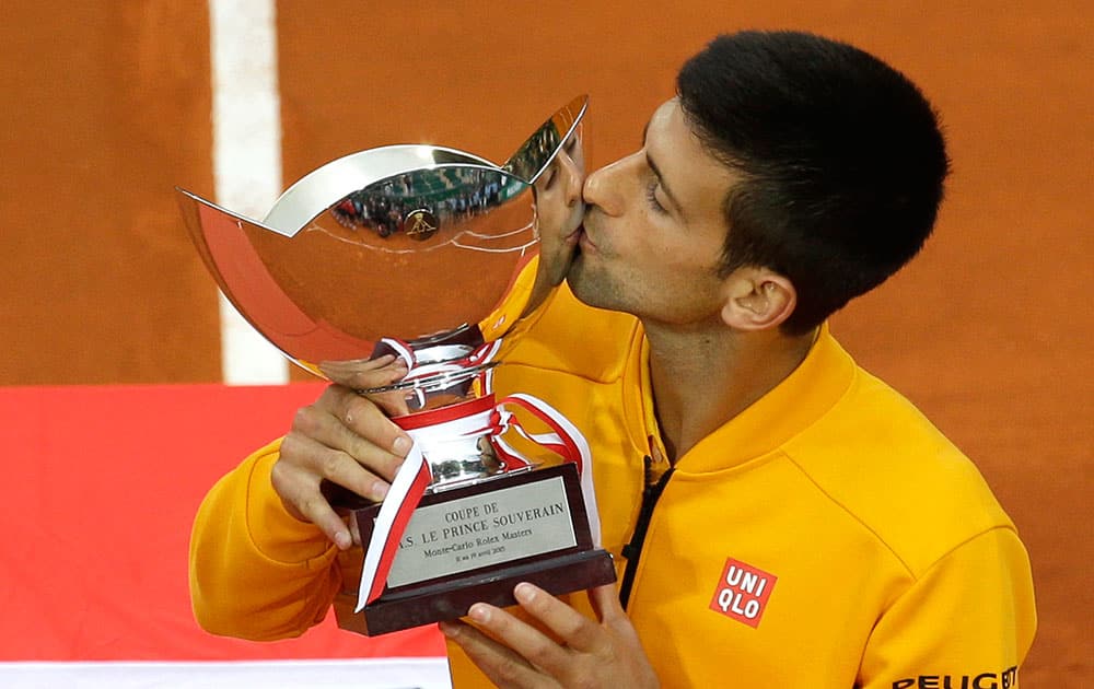 Novak Djokovic of Serbia kisses his trophy after defeating Thomas Berdych of Czech republic in their final match of the Monte Carlo Tennis Masters tournament.
