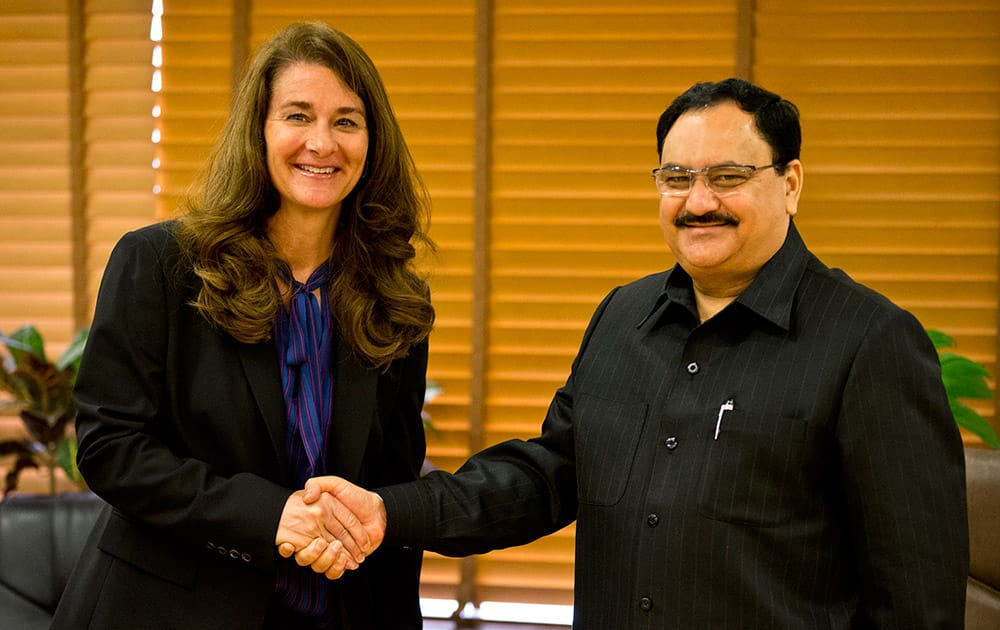 Melinda Gates, wife of Microsoft founder and billionaire philanthropist Bill Gates poses for photographers as she shakes hands with Union Minister for Health and Family Welfare Jagat Prakash Nadda in New Delhi. India conferred one of its highest civlian awards on Bill Gates and his wife Melidna for their work to promote global health and development. 