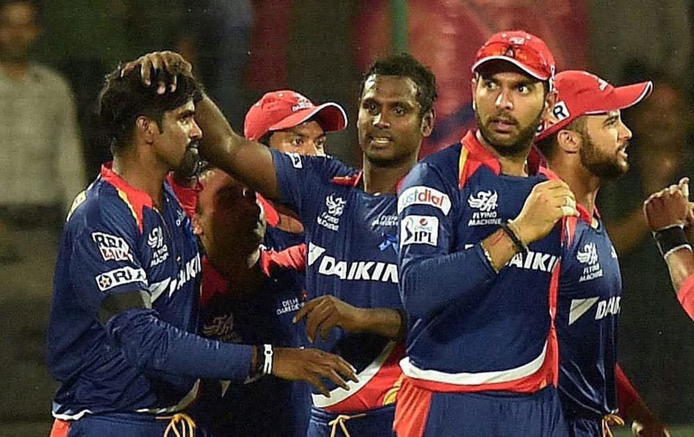 Delhi Daredevils players celebrate the wicket of Manish Panday of Kolkata Knight Riders during their IPL match at Feroz Shah Kotla Stadium in New Delhi.