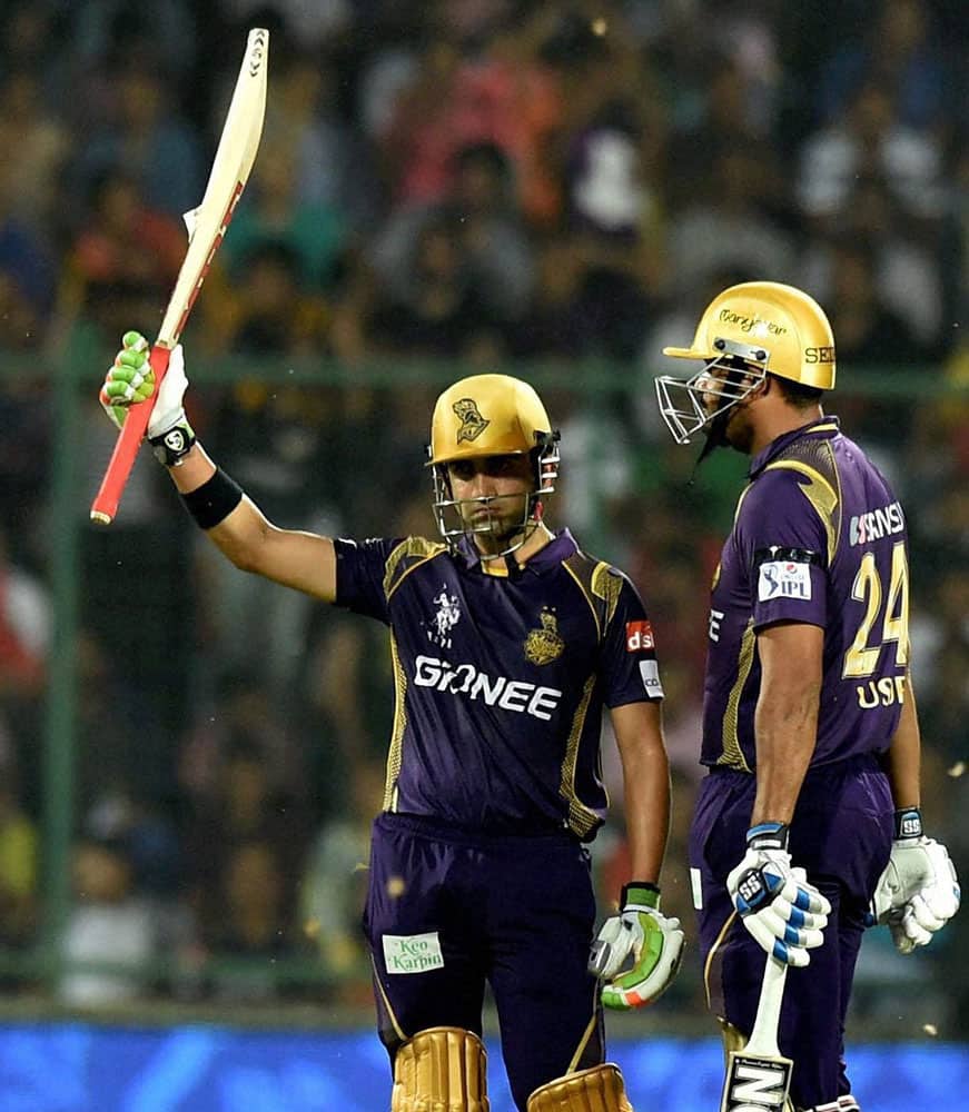 KKRs captain Gautam Gambhir raise his bat after completes his half century against Delhi Daredevils during their IPL match at Feroz Shah Kotla Stadium in New Delhi.