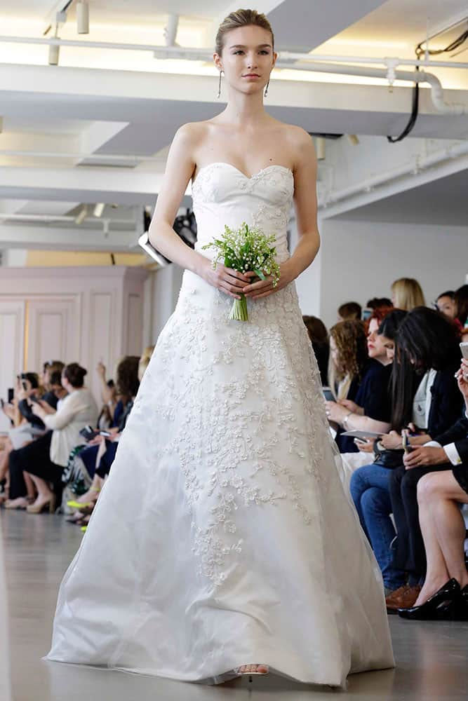 a model wears a creation from the Oscar de la Renta Bridal Spring 2016 collection in New York..