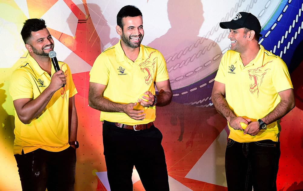 Chennai Super Kings Skipper M S Dhoni with team mates Irfan Pathan and Suresh Raina during an event in Bengaluru.