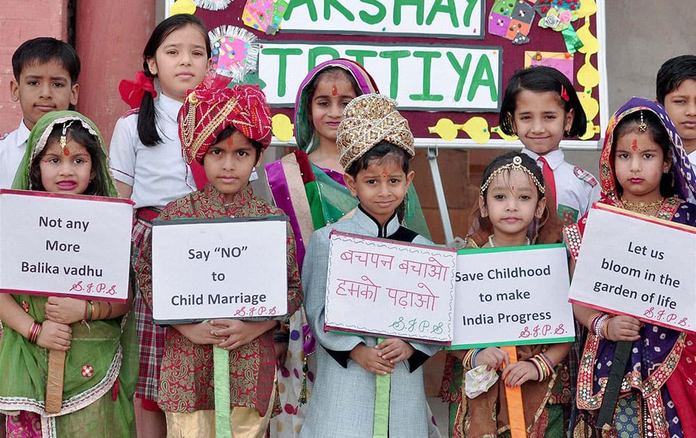 School children take part in an awareness campaign to stop child marriages on Akshaya Tritiya in Bikaner in Rajasthan.