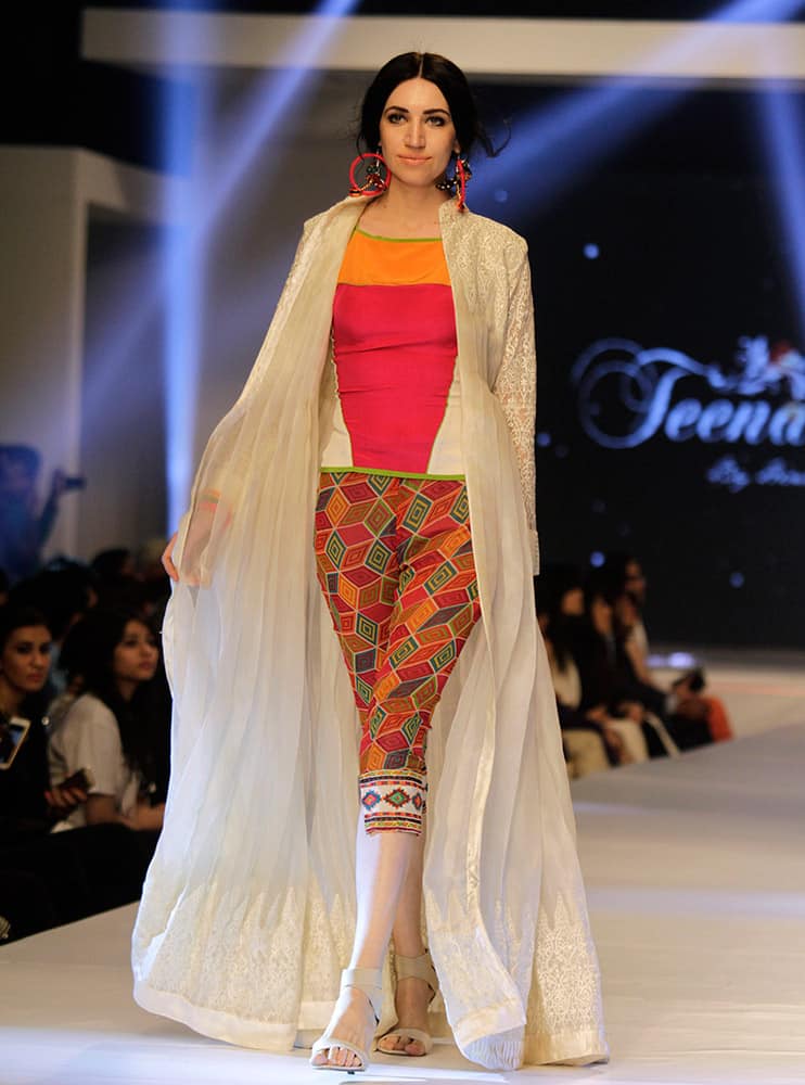 A model presents creations by Pakistani designer Hina Butt on the second-day of PFDC Sunsilk Fashion Week Spring/Summer 2015 in Lahore, Pakistan.