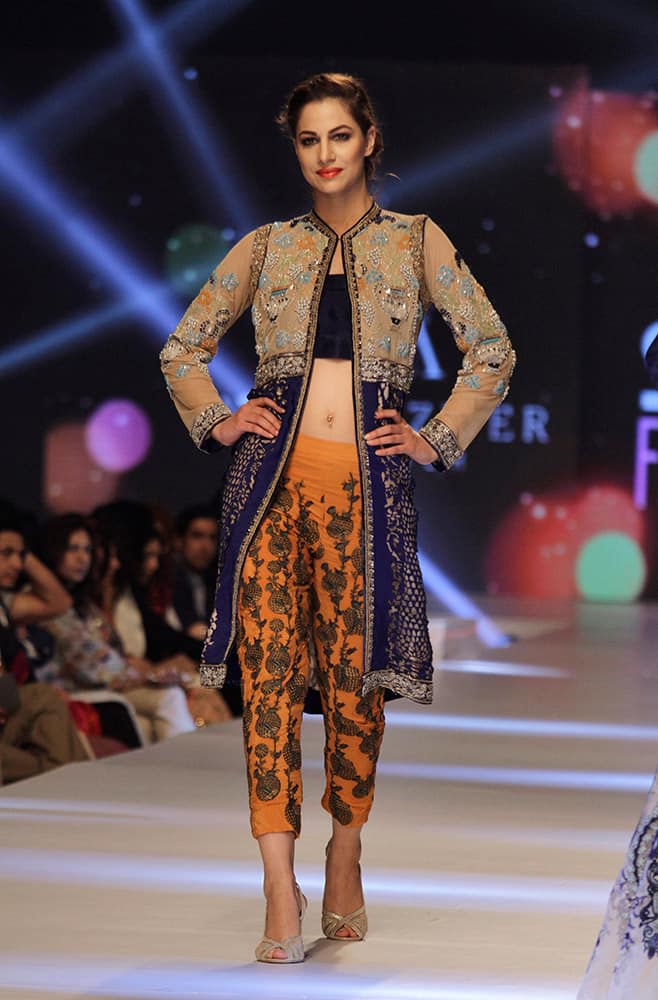 A model presents creations by Pakistani designer Nida Azwer Atelier on the second-day of PFDC Sunsilk Fashion Week Spring/Summer 2015 in Lahore, Pakistan.