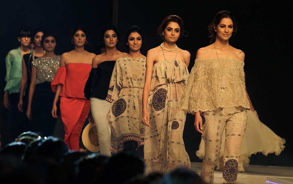 Models present creations by Pakistani designer Misha Lakhani on the first day PFDC Sunsilk Fashion Week Spring/Summer 2015 in Lahore, Pakistan.