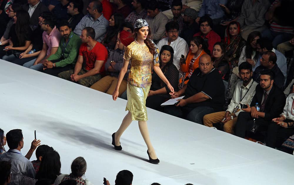 A model presents a creation by Pakistani designer Harmony on the third-day of PFDC Sunsilk Fashion Week Spring/Summer 2015, in Lahore, Pakistan.