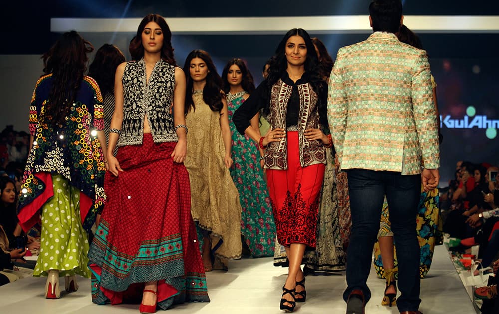 Models present creations by Pakistani designer Gul Ahmed on the third-day of PFDC Sunsilk Fashion Week Spring/Summer 2015, in Lahore, Pakistan.