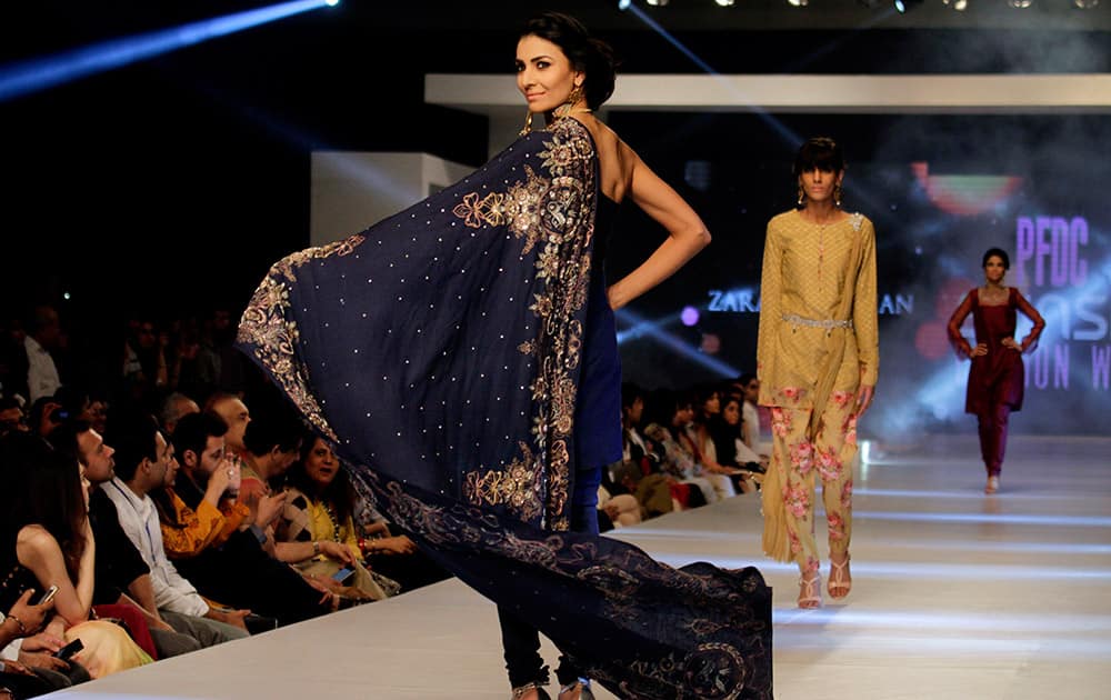 A model presents creations by Pakistani designer Zara Shajahan on the second-day of PFDC Sunsilk Fashion Week Spring/Summer 2015 in Lahore, Pakistan.