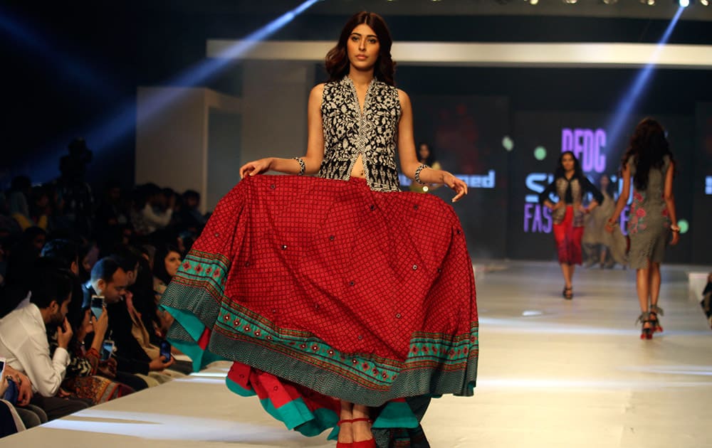 A model presents a creation by Pakistani designer Gul Ahmed on the third-day of PFDC Sunsilk Fashion Week Spring/Summer 2015, in Lahore, Pakistan.