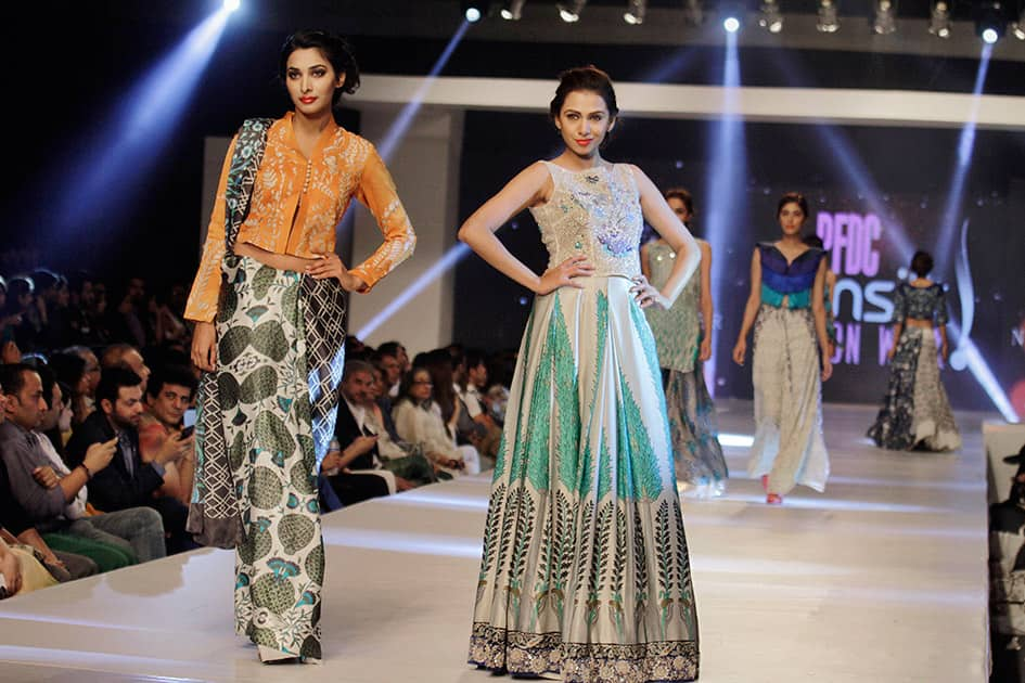 Model present creations by Pakistani designer Nida Azwer Atelier on the second-day of PFDC Sunsilk Fashion Week Spring/Summer 2015 in Lahore, Pakistan.