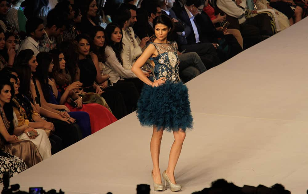 A model presents creations by Pakistani designer Syeda Amera on the last day of PFDC Sunsilk Fashion Week Spring/Summer 2015, in Lahore, Pakistan.