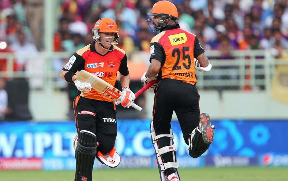 Sunrisers Hyderabad players Shikhar Dhawan and David Warner run between the wickets during their IPL T20 match against Kolkata Knight Riders in Visakhapatnam.