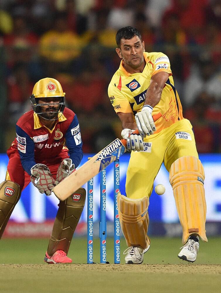 Chennai Super Kings M S Dhoni plays a shot during IPL 8 against Royal Challengers Bangalore match at Bengaluru.