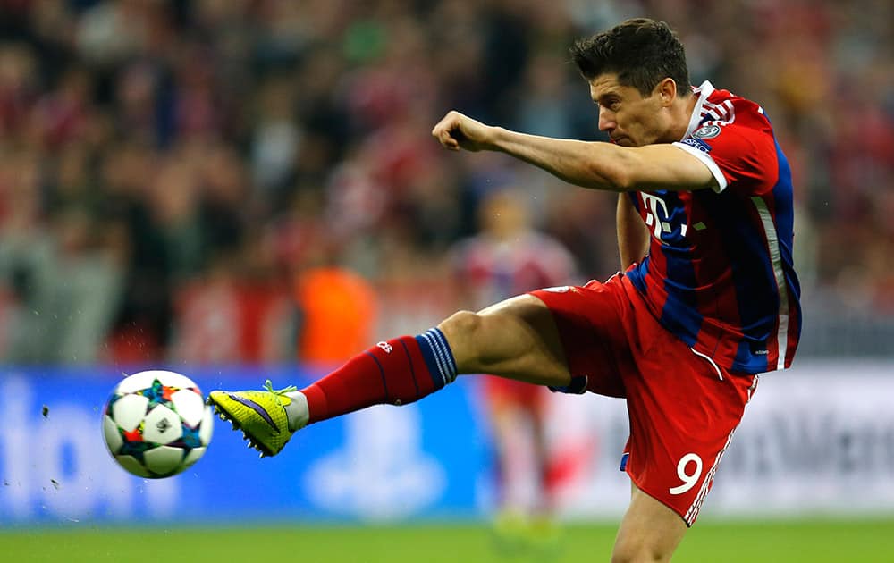 Bayern's Robert Lewandowski kicks the ball during the soccer Champions League quarterfinal second leg match between Bayern Munich and FC Porto at the Allianz Arena in Munich, southern Germany.