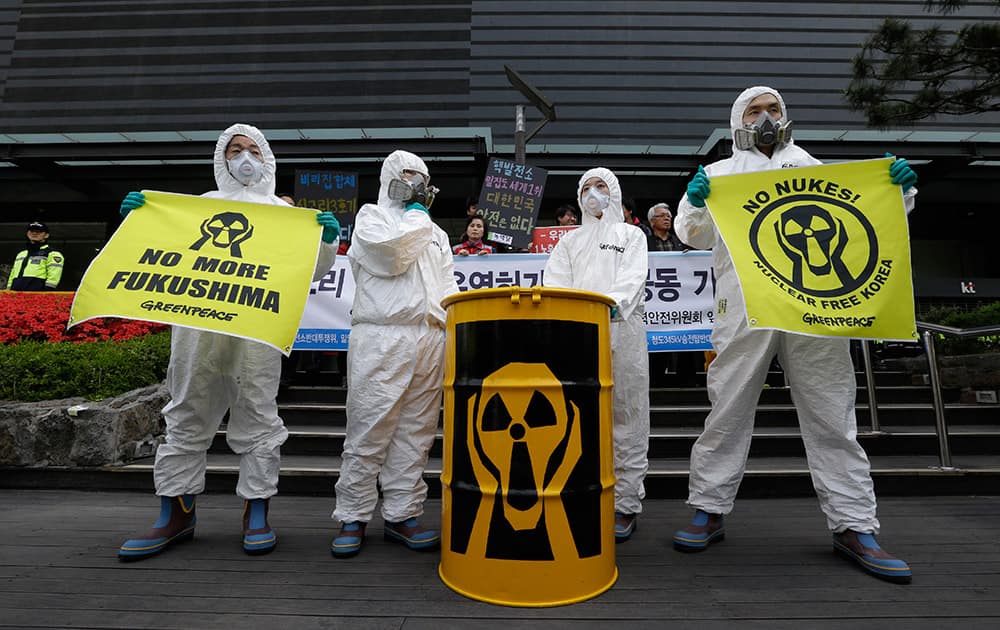 Greenpeace activists stage a rally against nuclear power plants in front of the Nuclear Safety and Security Commission in Seoul, South Korea.