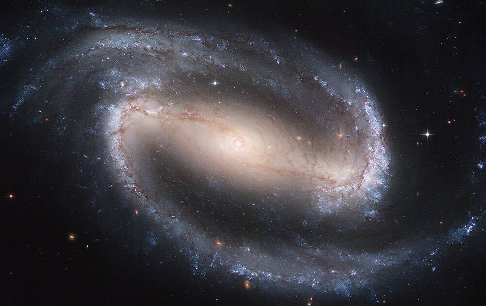 This image made by the NASA/ESA Hubble Space Telescope shows the barred spiral galaxy NGC 1300. It is considered to be prototypical of barred spiral galaxies. The Hubble Space Telescope marks its 25th anniversary.