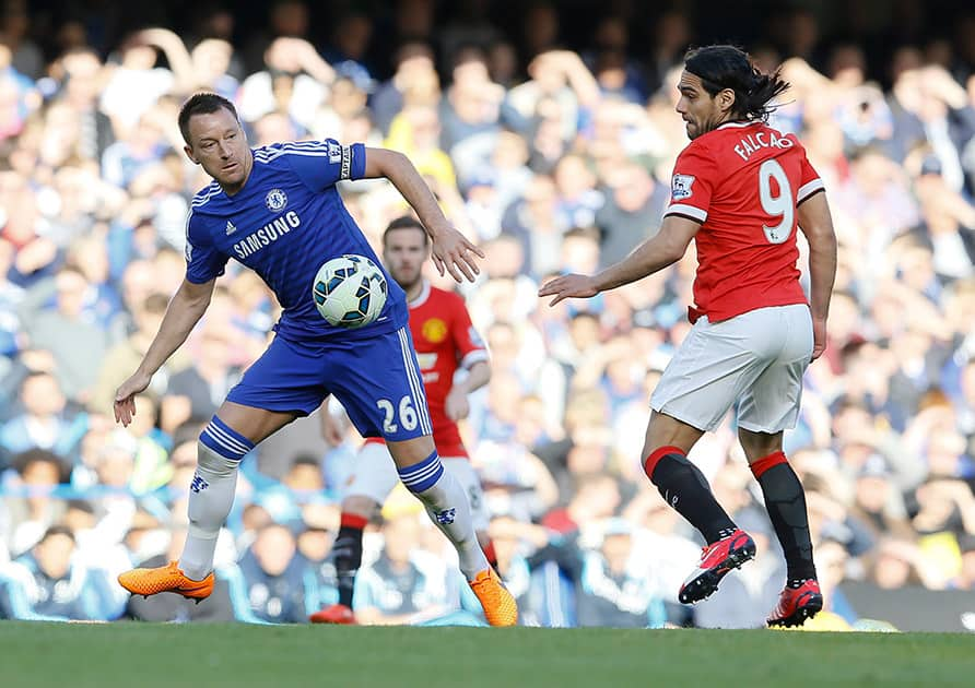 Chelsea's John Terry, left, challenges for the ball with Manchester United's Radamel Falcao during the English Premier League soccer match between Chelsea and Manchester United at Stamford Bridge stadium in London.