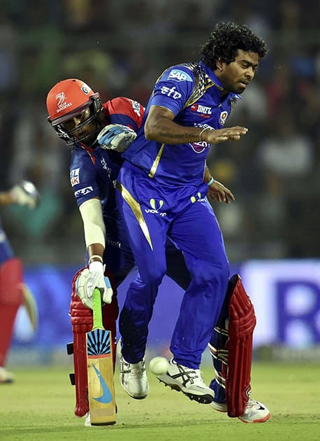 Delehi Daredavils batsman J P Duming colldies with Mumbai Indians Lasith Malinga during their IPL t 20 match in New Delhi.